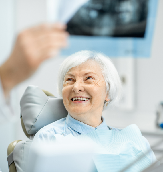 Smiling woman outside with healthy teeth